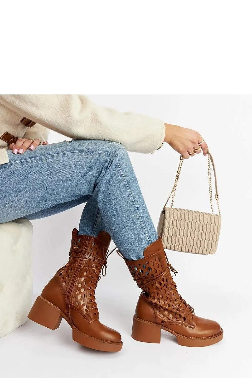 Brown lacy ankle boots with a heel