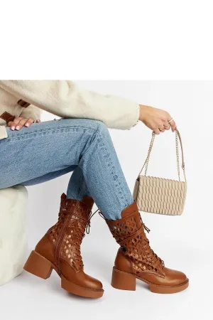 Brown lacy ankle boots with a heel