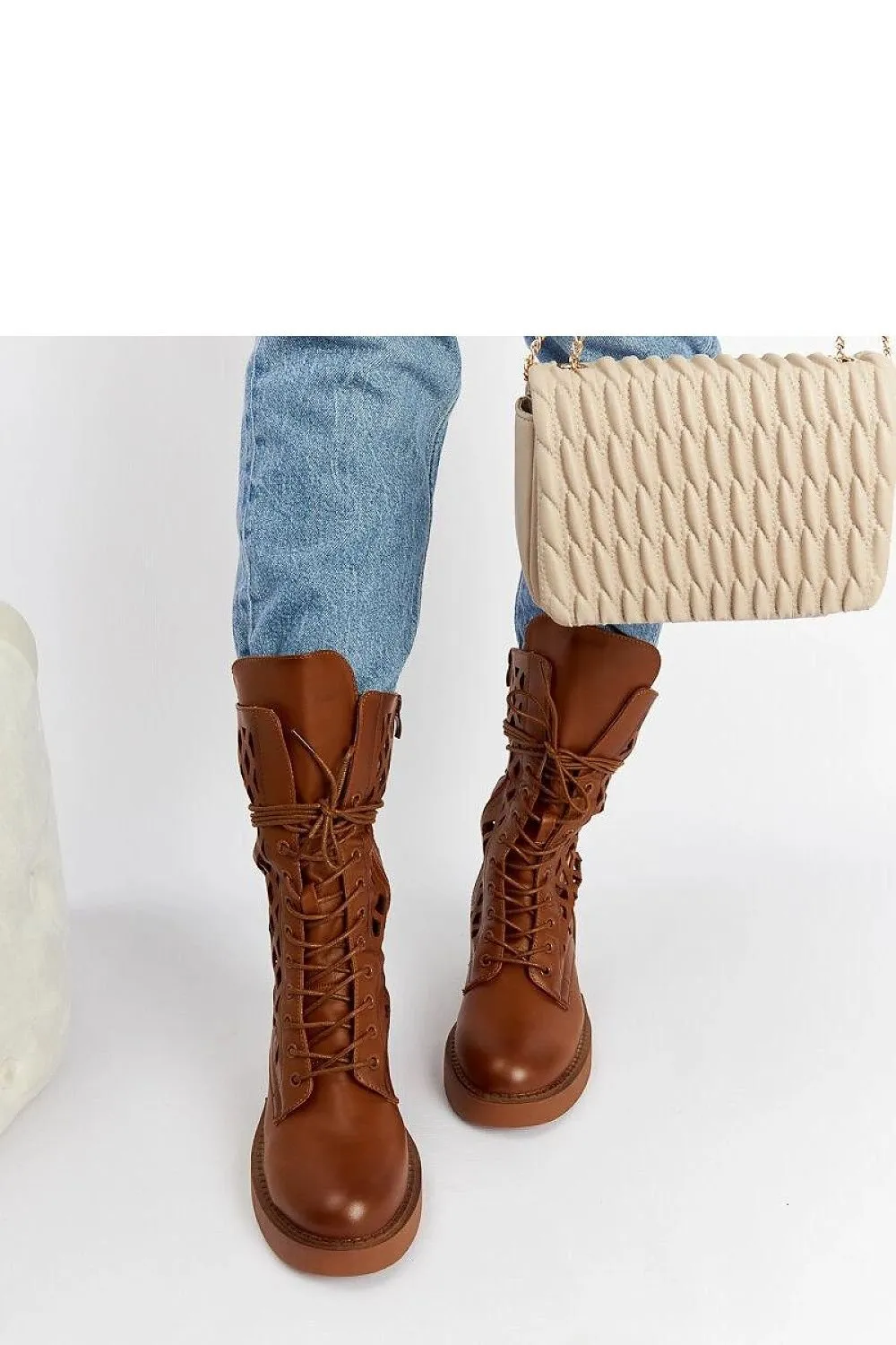 Brown lacy ankle boots with a heel